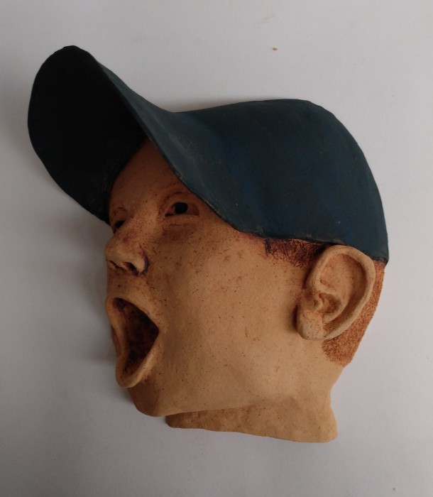 Dennis, living with and healing from depression, high fire wall hung ceramic relief sculpture